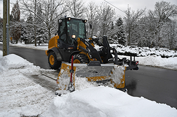 Snow windrow clearing